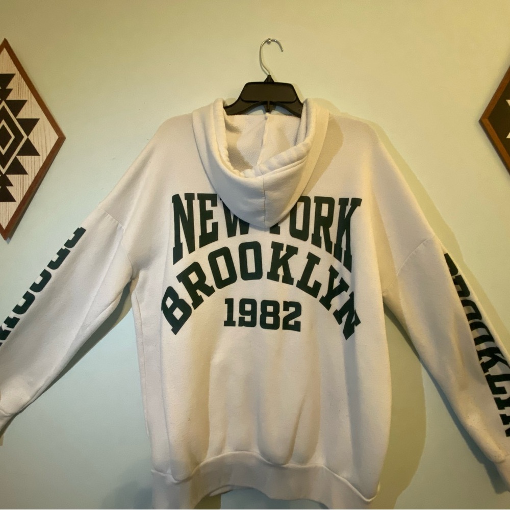 White and Green Sweater with Bold Print